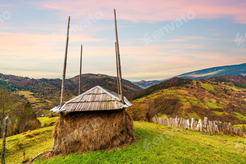 Preview: Haystack in a green meadow in not very good weather