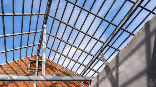 Preview: Structure roof truss steel building construction against blue sky background