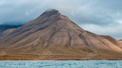 Preview: Breathtaking view of the rugged mountains of Svalbard under an overcast sky