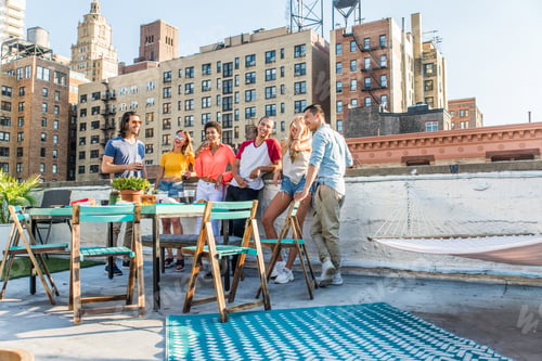 Preview: Group of friends having party on a rooftop