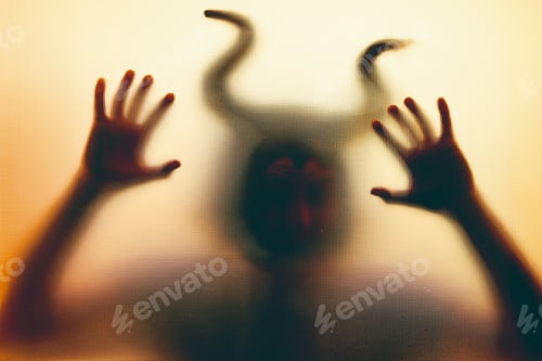 Preview: Horror, halloween background - Shadowy figure with horns behind the glass