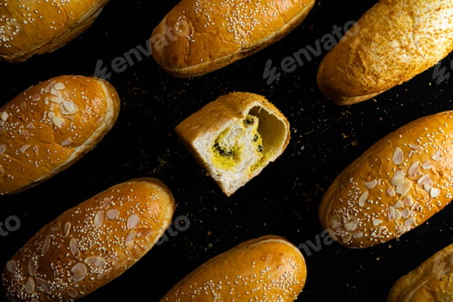 Preview: Top view of bread loaves covered in sesame seeds and peanuts
