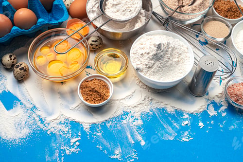 Preview: Baking ingredients on blue color background, top view