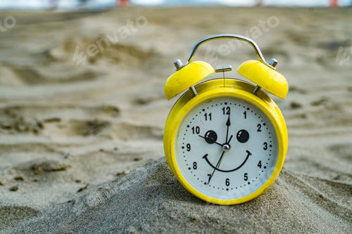 Preview: yellow clock on the beach vacation fun