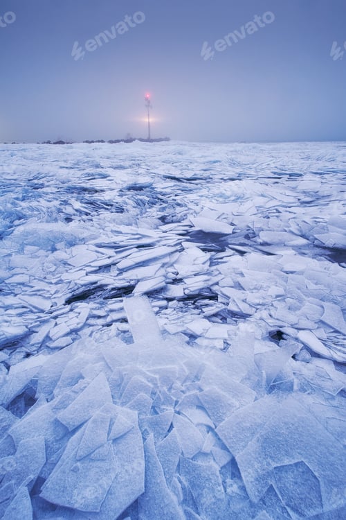 Preview: Ice cracks on the surface of a lake background lighthouse