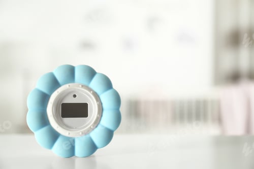 Preview: Digital temperature and humidity control in baby room interior. Space for text