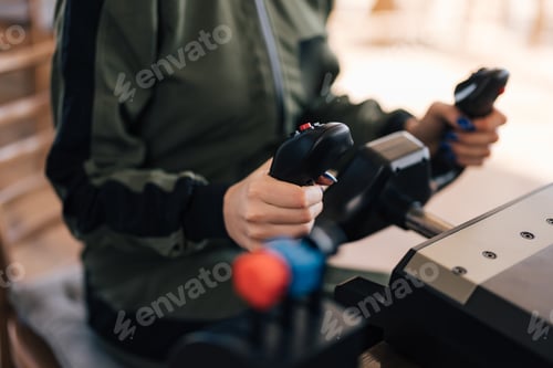 Preview: Close up, female practicing aircraft simulation.
