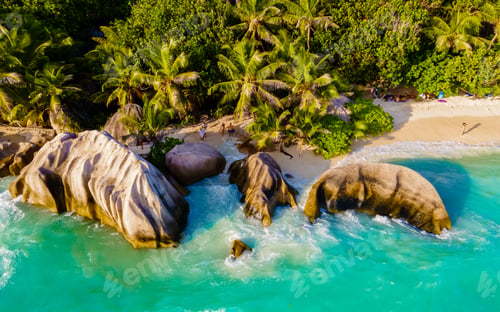 Preview: Anse Source d'Argent, La Digue Seychelles, a young couple of men and women on a tropical beach