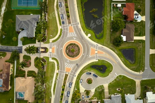 Preview: Aerial view of road roundabout intersection with moving cars traffic.