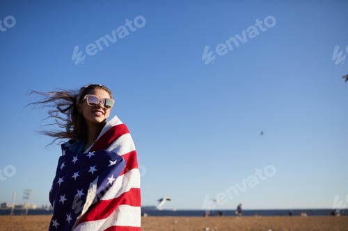 Preview: Jolly woman wrapped in national flag