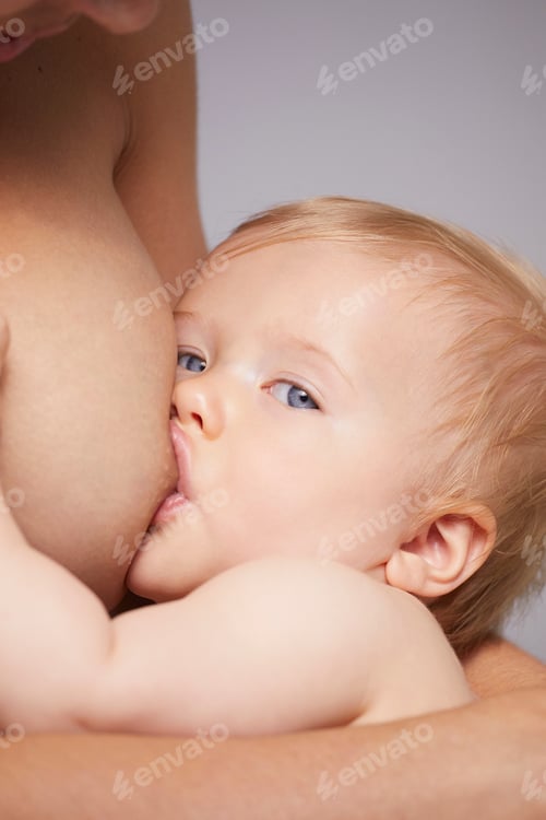 Preview: Infant nourishing deeply in a moment of maternal connection