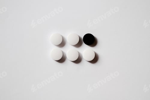Preview: White and Black Circular Objects on a White Background