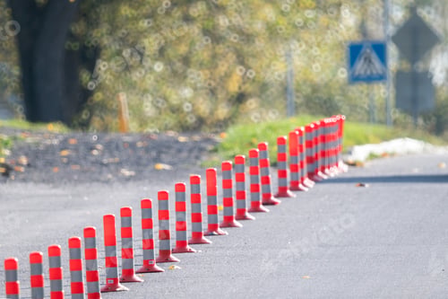 Preview: Road red and white bollards are installed along the roadway