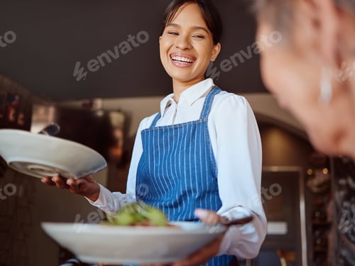 Preview: Waitress in a restaurant, serving customer her food, healthy salad and gives service with a smile.