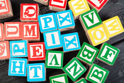 Preview: Letters background. Wooden cubes with letters on wooden background