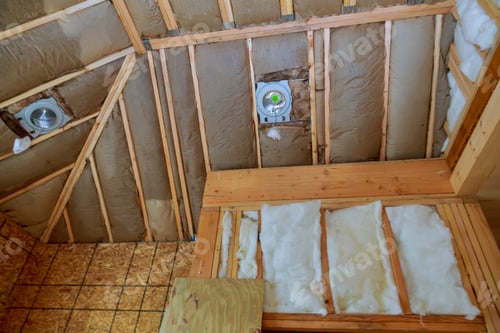 Preview: New frame house of fiberglass cold barrier insulation material in the sloping attic