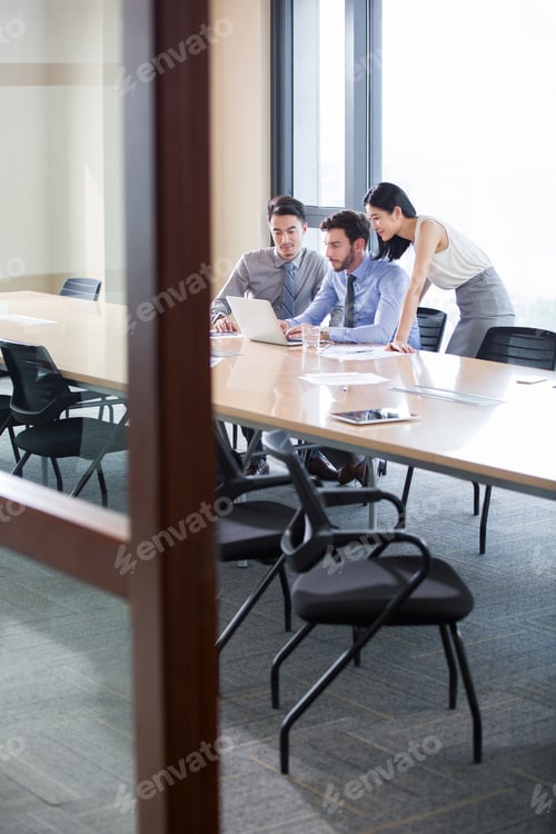 Preview: Business people talking in meeting room