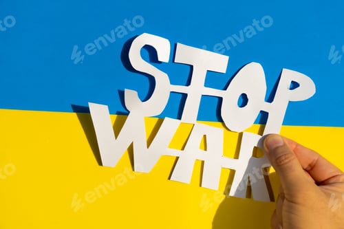 Preview: Stop war, conflict between Ukraine and Russia. Hands of a man holding a symbol to stop the war