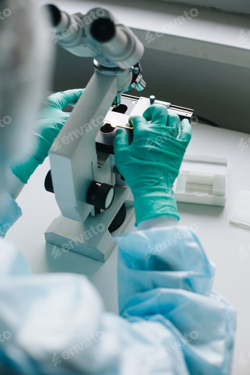 Preview: Crop hands putting microscope glasses in box