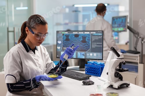 Preview: Doctor scientist conducting clinical experiment using micropipette