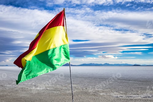 Preview: Scenery view of close-up bolivian flag on wild nature salt flat, scenic backgrounds