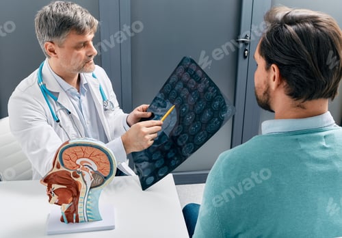 Preview: Doctor explaining to male patient results of MRI scan of his brain. Diagnosis of diseases and head