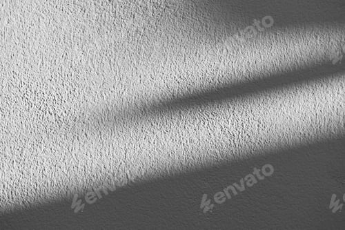 Preview: White paint stucco wall texture background. White wall texture in the sun.
