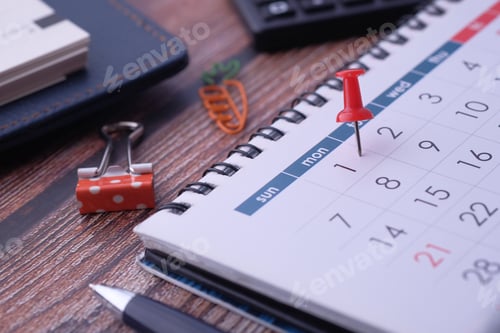 Preview: A tidy desk with a calendar and supplies, perfect for scheduling and task management