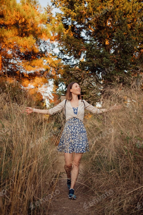 Preview: Smiling woman traveler exploring beautiful natural sites