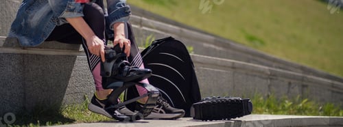 Preview: Fit legs in kangoo jumping shoes. womanpreparing for Kangoo Jumping training