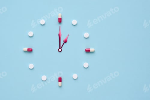 Preview: Clock created from pills and capsules on pastel blue background