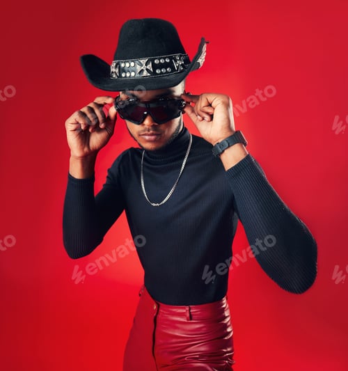 Preview: Fashion, man and cowboy hat, sunglasses and trendy clothes with gen z isolated on red background. C