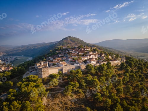 Preview: Aerial view of the old Castle in Berat and its ancient neighborhoods in sunset light