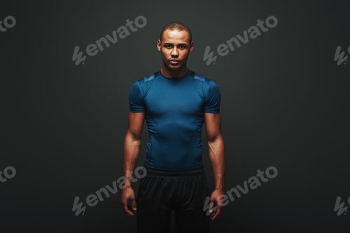 Preview: The only bad workout is the one that didn't happen. Handsome sportsman standing over dark