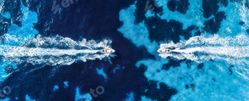 Preview: Vacation and leisure. Seascape with motorboats. Aerial view on fast boat on blue sea at sunny day.