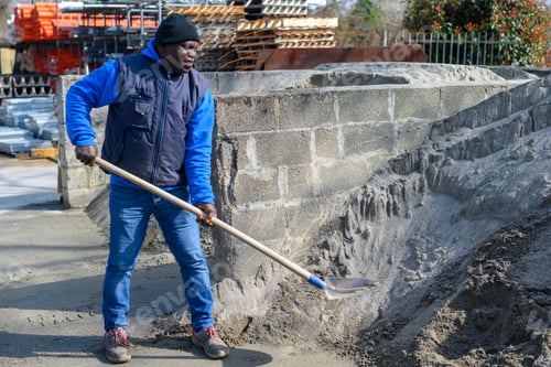 Preview: A man is shoveling dirt with a shovel