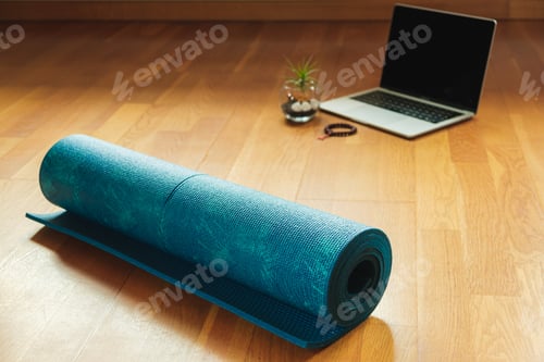 Preview: Blue Yoga Mat and Laptop on Wooden Floor