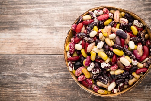 Preview: Beans on the bowl and wooden background.