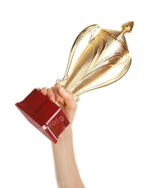 Preview: Young woman holding gold trophy cup on white background, closeup