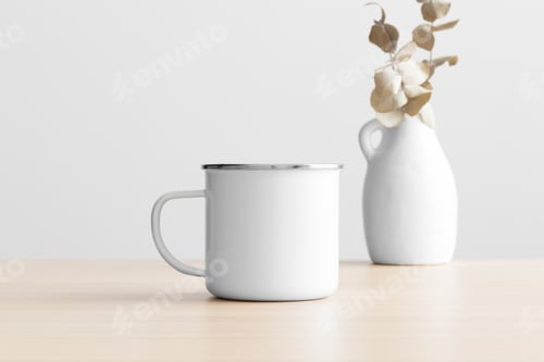 Preview: Enamel mug mockup with an eucalyptus decoration on the wooden table.