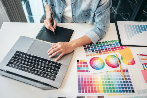 Preview: Young creative graphic designer working on color selection and d