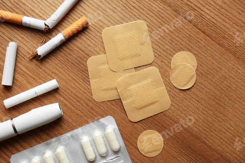Preview: Flat lay composition with nicotine patches on wooden table