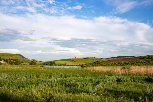 Preview: summer landscape with green meadow and blue sky