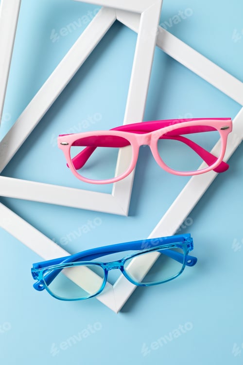 Preview: Child eyeglasses over pastel background. Optical store, glasses selection for kids