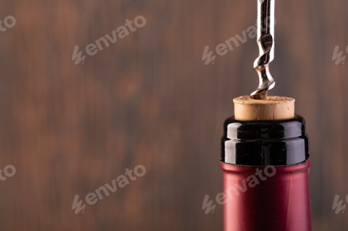 Preview: Corkscrew and bottle of wine