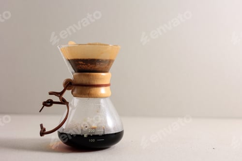 Preview: Glass Coffeemaker with Tasty Drip Coffee on Cream Table