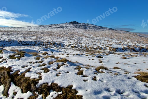 Preview: Picturesque winter scene featuring a snow-covered hill in Dartmoor National Park, UK
