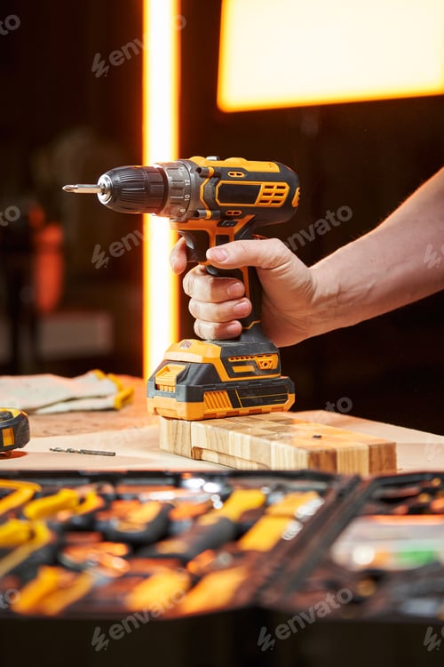 Preview: Hand Holding an Electric Drill in the Workshop