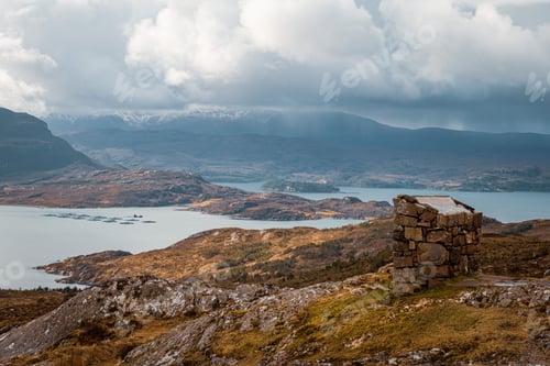 Preview: Scenic Scottish Highlands disappearing into misty mountains, with dense foliage on either side