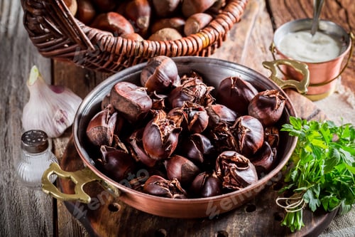 Preview: Closeup of hot chestnuts with garlic sauce